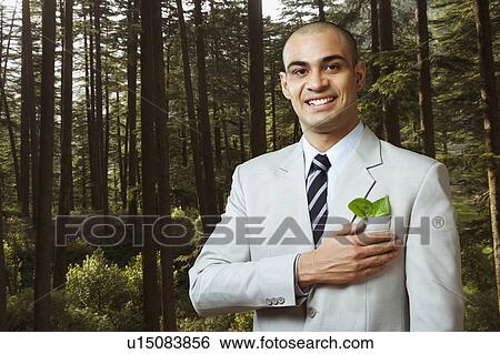 Stock Photograph - Portrait of a businessman smiling. Fotosearch