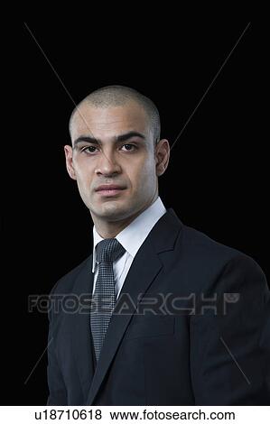 Stock Photo - Portrait of a businessman thinking. Fotosearch