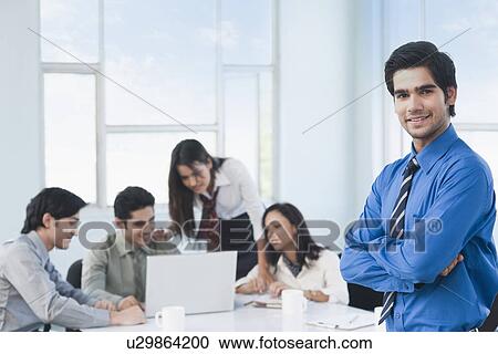 Portrait of a businessman with his arms crossed View Large Photo Image Stock Image - Portrait of a businessman with his arms crossed. Fotosearch