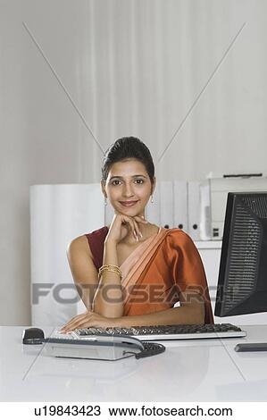 Portrait of a businesswoman in an office View Large Photo Image Stock Image - Portrait of a businesswoman in an office. Fotosearch