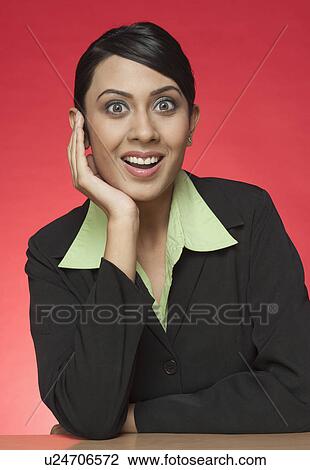 Portrait of a businesswoman looking surprised View Large Photo Image Stock Image - Portrait of a businesswoman looking surprised. Fotosearch