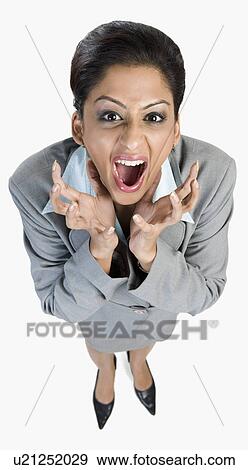 Stock Photo - Portrait of a businesswoman looking angry. Fotosearch