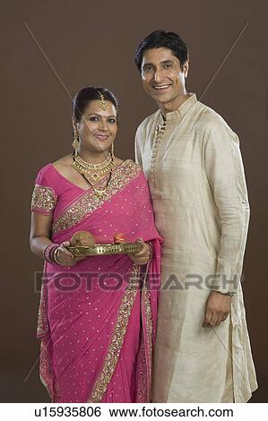 Portrait of a couple in traditional clothing View Large Photo Image Stock Photograph - Portrait of a couple in traditional clothing. Fotosearch