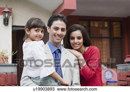 Stock Image - Portrait of a family smiling. Fotosearch