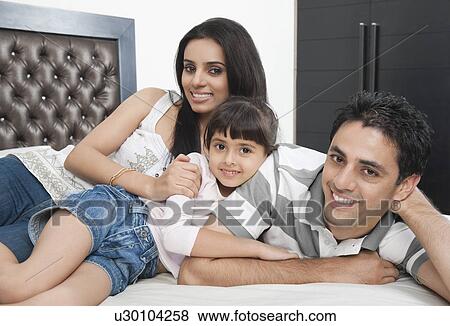 Stock Photo - Portrait of a family smiling. Fotosearch