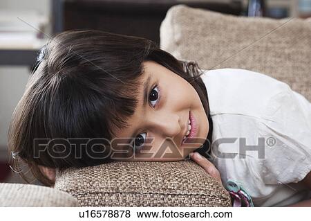 Stock Photo - Portrait of a girl smiling. Fotosearch