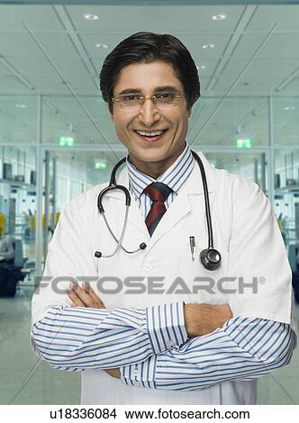 Portrait of a male doctor smiling View Large Photo Image Picture - Portrait of a male doctor smiling. Fotosearch