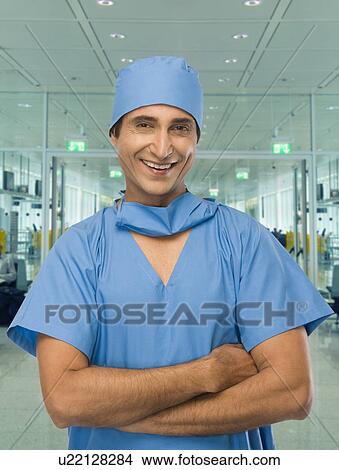 Portrait of a male surgeon smiling View Large Photo Image Picture - Portrait of a male surgeon smiling. Fotosearch