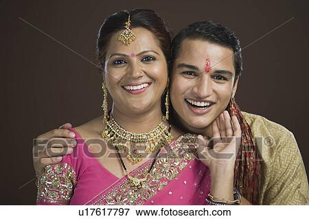 Portrait of a man and his mother smiling View Large Photo Image Stock Photo - Portrait of a man and his mother smiling. Fotosearch