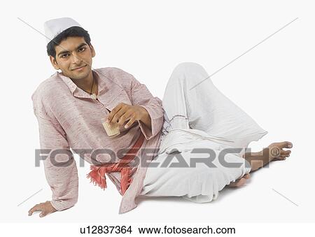 Portrait of a man drinking tea View Large Photo Image Picture - Portrait of a man drinking tea. Fotosearch