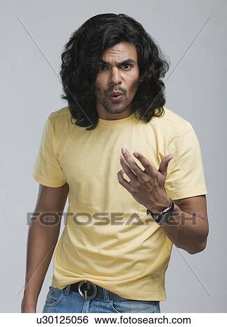 Portrait of a man looking serious View Large Photo Image Stock Photograph - Portrait of a man looking serious. Fotosearch