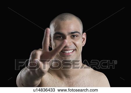 Portrait of a man making a peace sign View Large Photo Image Stock Image - Portrait of a man making a peace sign. Fotosearch