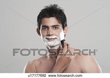 Portrait of a man shaving View Large Photo Image Stock Image - Portrait of a man shaving. Fotosearch
