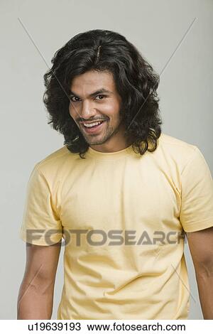 Stock Image - Portrait of a man smiling. Fotosearch
