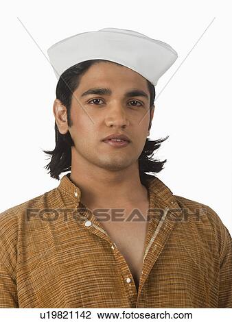 Stock Image - Portrait of a man smirking. Fotosearch