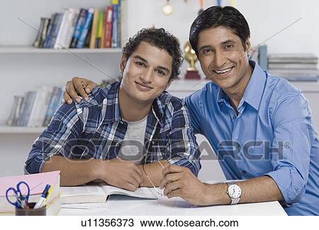 Stock Image - Portrait of a man with his arm around his son. Fotosearch