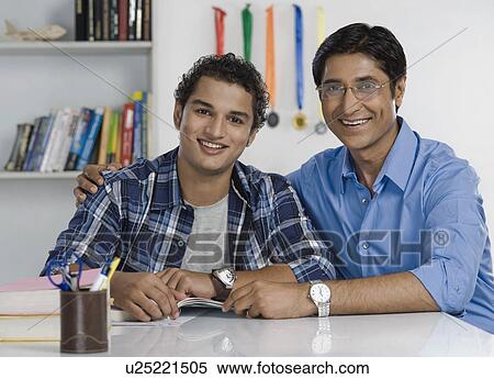 Stock Photography - Portrait of a man with his arm around his son. Fotosearch