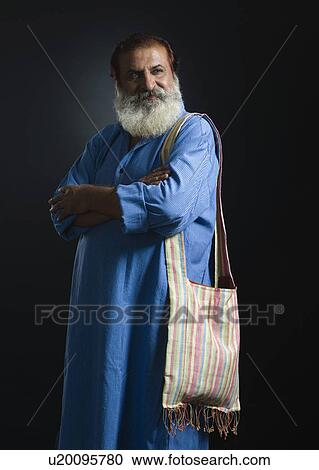 Portrait of a philosopher standing with his arms crossed View Large Photo Image Stock Image - Portrait of a philosopher standing with his arms crossed. Fotosearch
