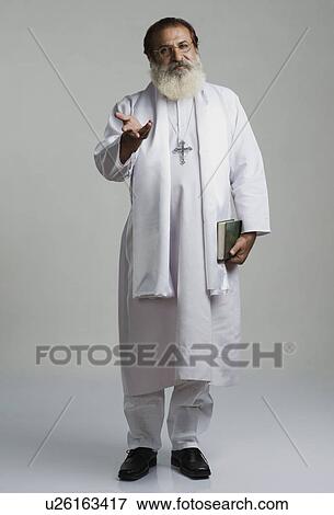 Stock Photo - Portrait of a priest gesturing. Fotosearch