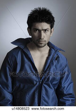 Portrait of a stylish young man posing View Large Photo Image Stock Image - Portrait of a stylish young man posing. Fotosearch