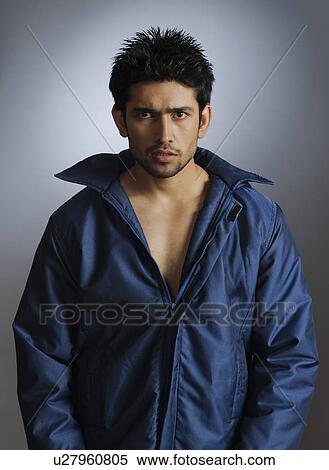 Portrait of a stylish young man posing View Large Photo Image Stock Photography - Portrait of a stylish young man posing. Fotosearch