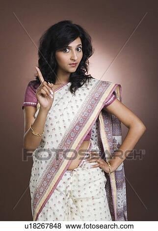 Portrait of a woman gesturing View Large Photo Image Stock Photo - Portrait of a woman gesturing. Fotosearch