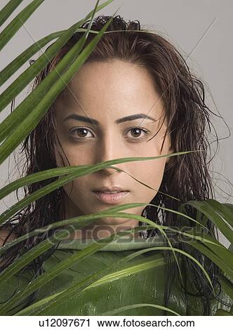 Stock Image - Portrait of a woman getting spa treatment. Fotosearch