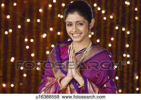 Stock Photo - Portrait of a woman greeting. Fotosearch