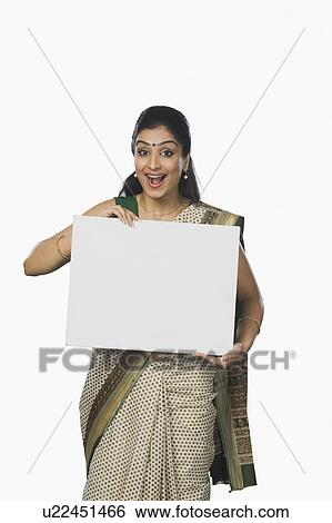 Stock Photograph - Portrait of a woman holding a whiteboard and laughing. Fotosearch
