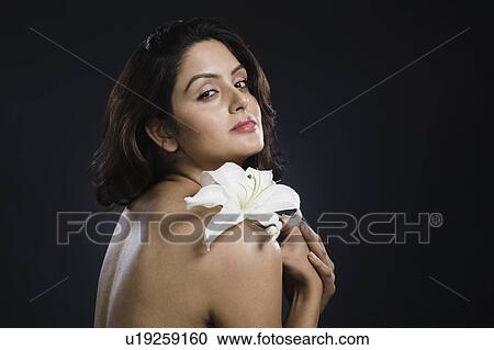 Portrait of a woman holding a Tiger Lily flower View Large Photo Image Stock Image - Portrait of a woman holding a Tiger Lily flower. Fotosearch