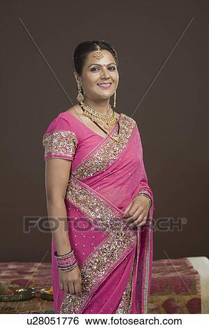 Portrait of a woman in sari and smiling View Large Photo Image Stock Photograph - Portrait of a woman in sari and smiling. Fotosearch