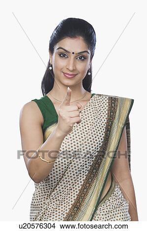 Picture - Portrait of a woman pointing forward. Fotosearch
