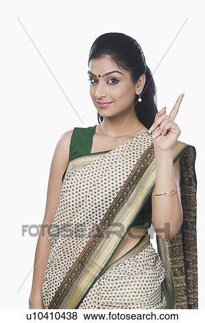 Stock Photo - Portrait of a woman pointing. Fotosearch