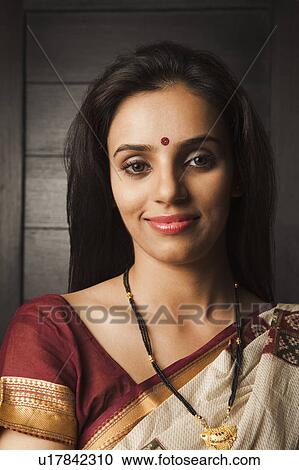 Stock Image - Portrait of a woman smiling. Fotosearch