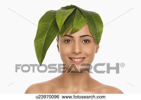 Portrait of a woman wearing leaves on her head View Large Photo Image Stock Photograph - Portrait of a woman wearing leaves on her head. Fotosearch