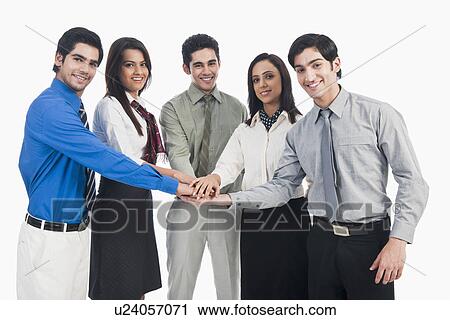 Portrait of business executives stacking hands View Large Photo Image Stock Image - Portrait of business executives stacking hands. Fotosearch