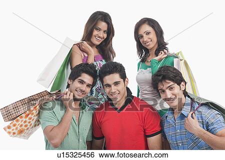 Portrait of friends holding shopping bags View Large Photo Image Stock Photograph - Portrait of friends holding shopping bags. Fotosearch