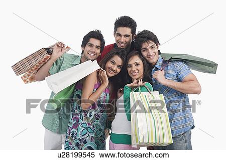 Portrait of friends holding shopping bags View Large Photo Image Stock Photography - Portrait of friends holding shopping bags. Fotosearch