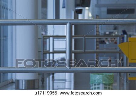 Stock Photography - Railing at an airport lounge, Paris, France. Fotosearch