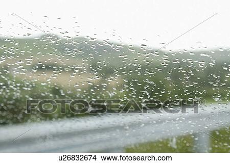 Rain drops on the windshield of a car, Dublin, Republic of Ireland View Large Photo Image Picture - Rain drops on the windshield of a car, Dublin, Republic of Ireland. Fotosearch