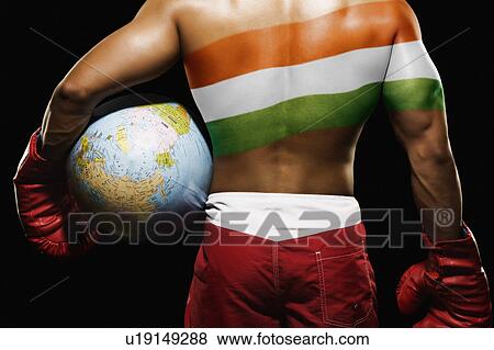 Rear view of a male boxer holding globe with Indian flag painted on his back View Large Photo Image Stock Photo - Rear view of a male boxer holding globe with Indian flag painted on his back. Fotosearch