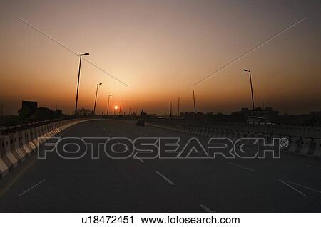 Road at sunset, National Highway 8, Gurgaon, Haryana, India View Large Photo Image Stock Image - Road at sunset, National Highway 8, Gurgaon, Haryana, India. Fotosearch