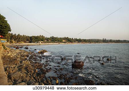 Stock Photo - Rocks on the coast, Goa, India. Fotosearch
