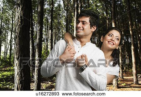 Romantic couple in a forest View Large Photo Image Stock Image - Romantic couple in a forest. Fotosearch