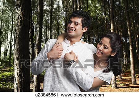 Romantic couple in a forest View Large Photo Image Stock Image - Romantic couple in a forest. Fotosearch
