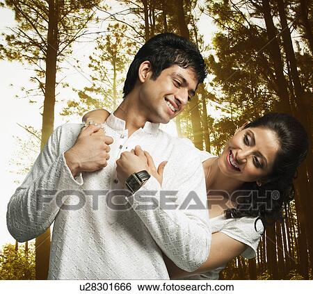 Romantic couple in a forest View Large Photo Image Stock Photograph - Romantic couple in a forest. Fotosearch