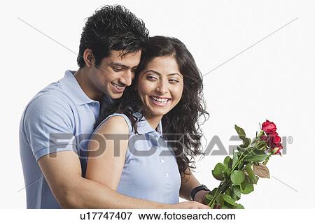Romantic couple with red roses View Large Photo Image Stock Photo - Romantic couple with red roses. Fotosearch