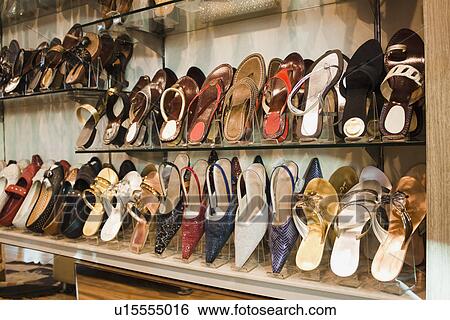 Stock Photograph - Sandals on display at a shoe store, New Delhi, India. Fotosearch