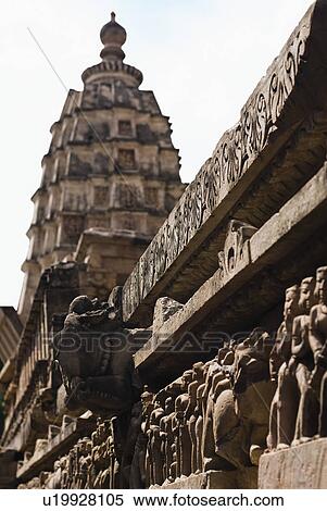 Stock Photography - Sculptures on the wall of a temple, Lakshmana Temple, Khajuraho, Chhatarpur District, Madhya Pradesh, India. Fotosearch