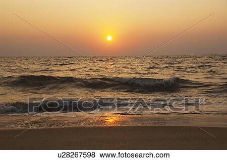 Stock Photo - Sea at sunset, Goa, India. Fotosearch